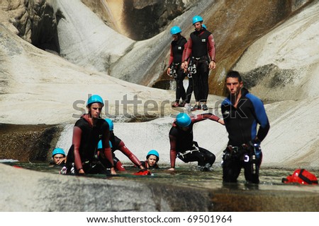 PURCARACCIA CANYON, CORSICA - AUGUST 28: An extreme sports team participates in a canyoning contest on the famous waterfalls of Purcaraccia valley, on August 28, 2010 in Corsica, France