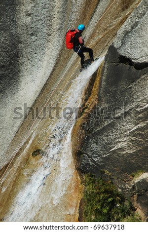 PURCARACCIA CANYON, CORSICA - AUGUST 28: An extreme sports team member participates in a canyoning contest on the famous waterfalls of Purcaraccia valley, on August 28, 2010 in Corsica, France