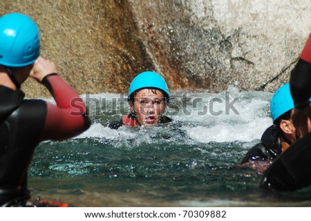 PURCARACCIA CANYON, CORSICA - AUGUST 28: An extreme sports team participates  in a canyoning contest on the famous waterfalls of Purcaraccia valley, on August 28, 2010 in Corsica, France