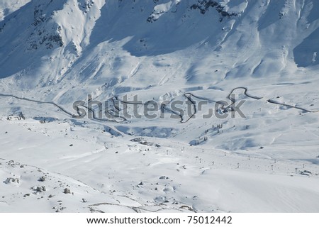 Winter road in a high mountain pass. Passo Pordoi (Pordoi Pass), Dolomites, Italy