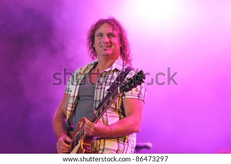 CLUJ NAPOCA, ROMANIA – OCTOBER 9: Mick McConnell from The Smokie pop-rock band performs live at Cluj Arena Grand Opening concert on October 9, 2011 in Cluj-Napoca, Romania