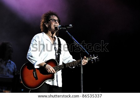 CLUJ NAPOCA, ROMANIA – OCTOBER 9: Singer Mike Craft from Smokie pop-rock band performs live at Cluj Arena Grand Opening concert on October 9, 2011 in Cluj-Napoca, Romania