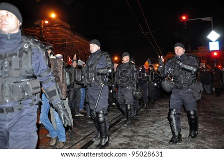 CLUJ NAPOCA - FEBRUARY 11: Special unit policemen controlling the street during a protest against ACTA, the web piracy treaty, and the government on February 11, 2012 in Cluj Napoca, Romania