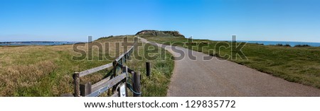 A walking path on Hengistbury Head, between the cities of Christchurch & Bournemouth in Dorset, England, with Warren Hill directly ahead.