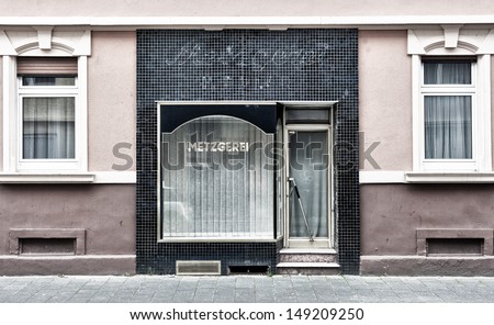 An old metzgerei (German for butcher\'s shop) that has long since closed.