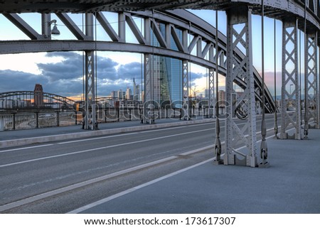 The Honsellbruecke at dusk with the new ECB (European Central Bank) and Frankfurt skyline in the distance.
