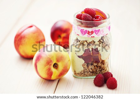 jar full of yogurt with cereals and fruits - diet and breakfast