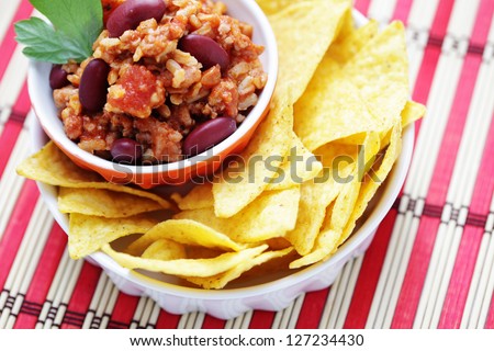 delicious chili con carne with tortilla chips - food and drink