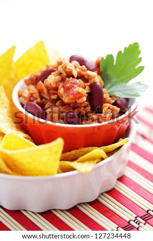 delicious chili con carne with tortilla chips - food and drink