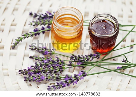 herbal honey in jar with fresh flower - sweet food /shallow DOF/