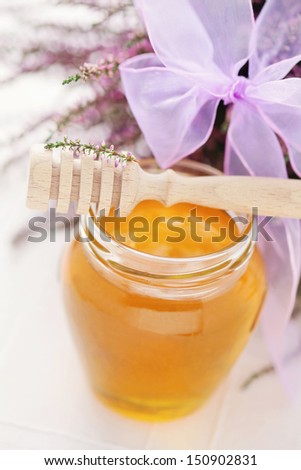 herbal honey in jar with fresh heather - sweet food /shallow DOF/