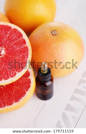 bottle of grapefruit essential oil - beauty treatment