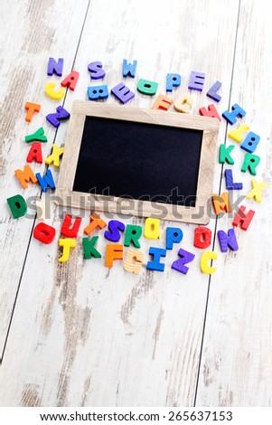 wooden alphabet blocks as a frame - education