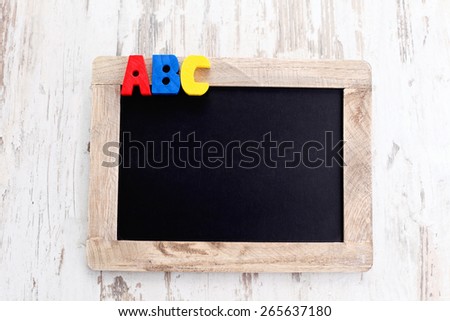 wooden alphabet blocks as a frame - education