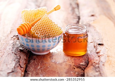 bowl of honey with honey comb - food and drink