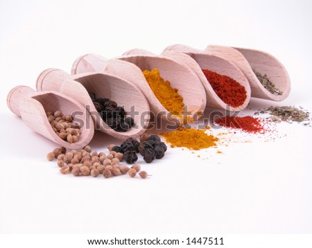 five kind of spices - turmeric paprika pepper coriander and herbs isolated on white