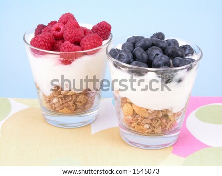 delicious low-calorie breakfast - berries yogurt and musli