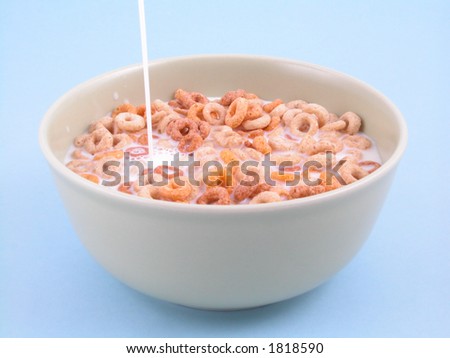 bowl full of cereal isolated on blue