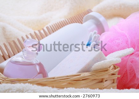 beauty accessories - towel soap bottle of shampoo in basket