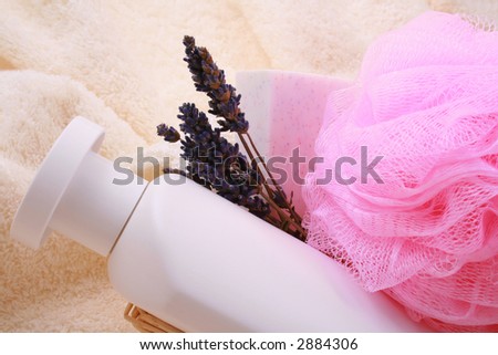close-ups of basket with shampoo lavender soap and sponge - beauty treatment