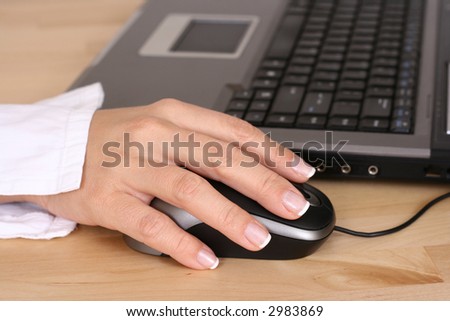 close-ups of mouse and woman hand - computer work