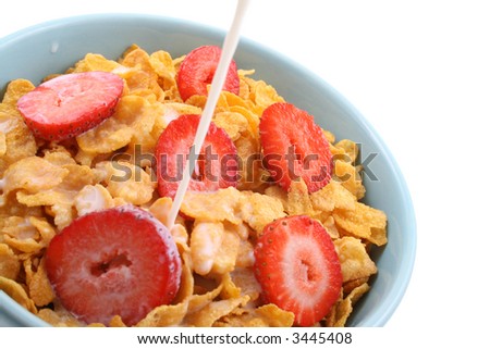 bowl of corn flakes with strawberry isolated on white