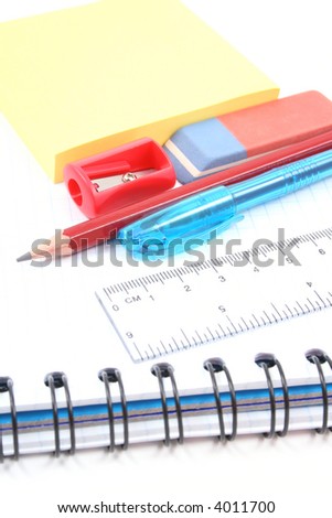 school supplies - pen pencil copy-book isolated on white