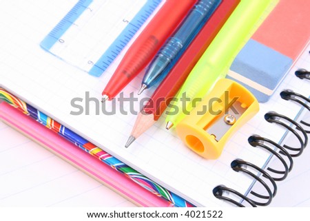 school supplies - pen pencil copy-book isolated on white