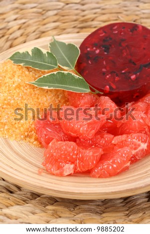 bowl of grapefruit bath salt bar of soap and some fresh fruits