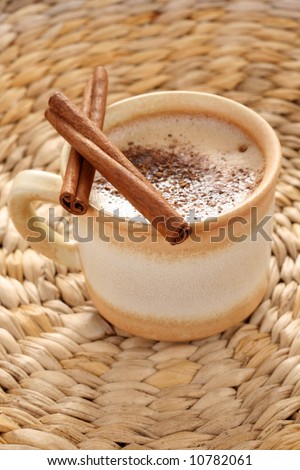 cup of hot coffee with cinnamon - food and drink