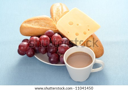 plate of bagel fresh grapes and cheese - perfect breakfast