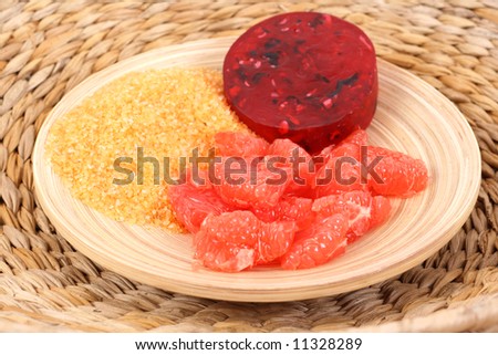bowl of grapefruit bath salt bar of soap and some fresh fruits