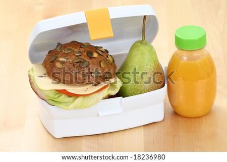box with sandwich apple and bottle of juice