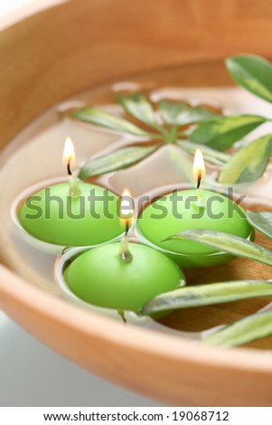 bowl of water with candles - beauty treatment