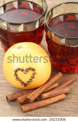 glass of hot wine with orange and spices