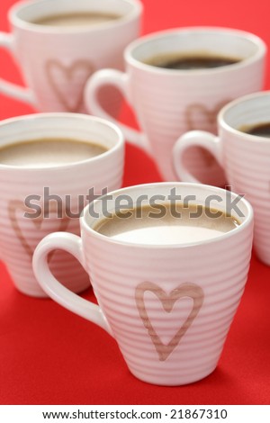 few cups of coffee on red background - food and drink