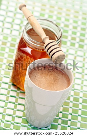 cup of coffee with honey - food and drink