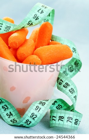 cup full of fresh carrots - on diet