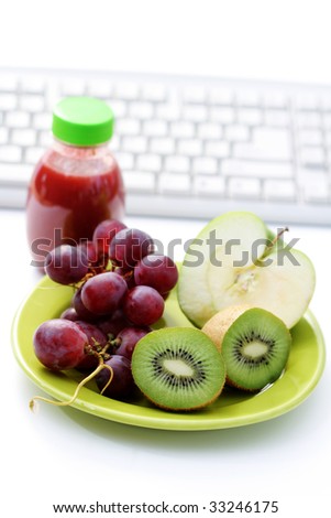 healthy snack in the office - plate of fresh fruits