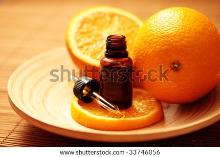 bottle of essential oil from oranges - alternative medicine