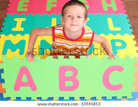 7 years old boy with colorful letters - schhol