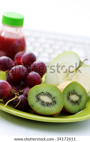 healthy snack in the office - plate of fresh fruits