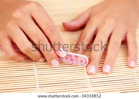 sexy female hands with nail polish - beauty treatment