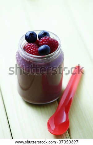 jar with raspberries and blueberries of baby food - food and drink