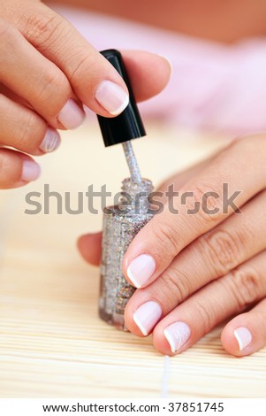 sexy female hands with nail polish - beauty treatment