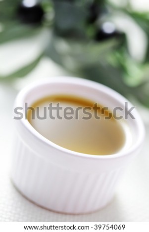 bowl of olive oil with salt and pepper - food and drink