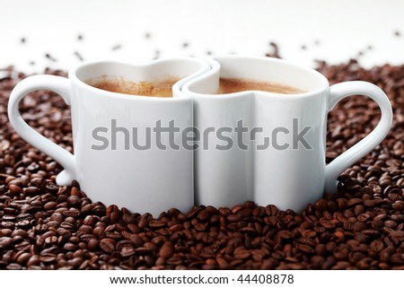 2 cups of coffee shape of heart and coffee beans - coffee time