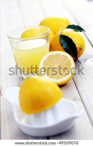 citrus squeezer and fresh lemon juice - food and drink