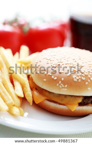 lunch time cheeseburger and french fries - food and drink