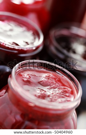 few jars of red red fruit jam - food and drink